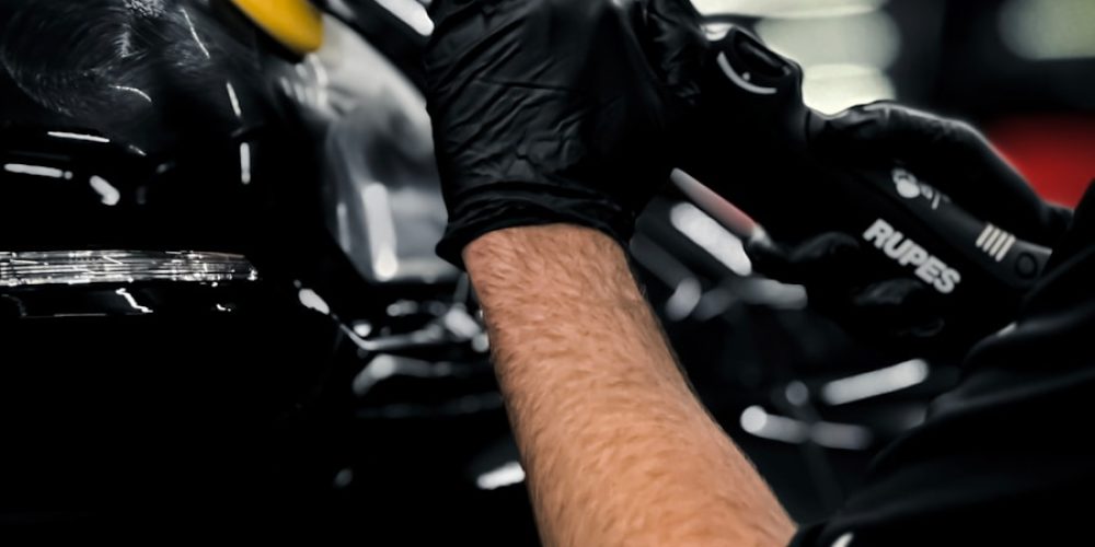 a man working on a car in a garage